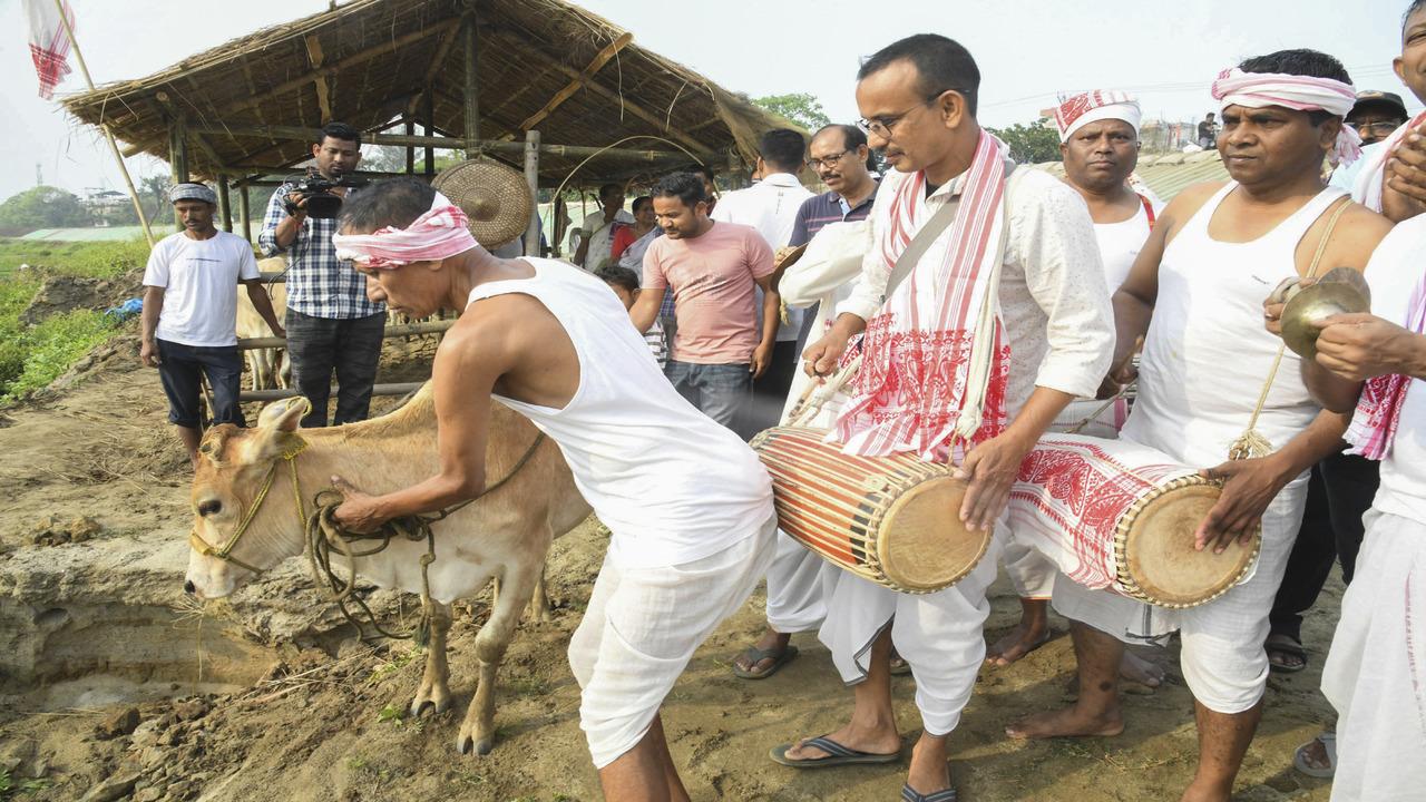 People perform rituals on the first day of Rongali Bihu celebrations, in Assam's Tezpur on Monday, April 14 (PTI Photo)
