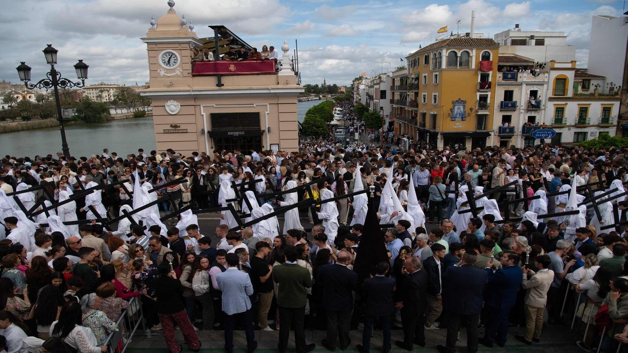 Scenes of solemnity awaken quietly as the traditional procession is led by the San Gonzalo brotherhood through the streets of Seville.