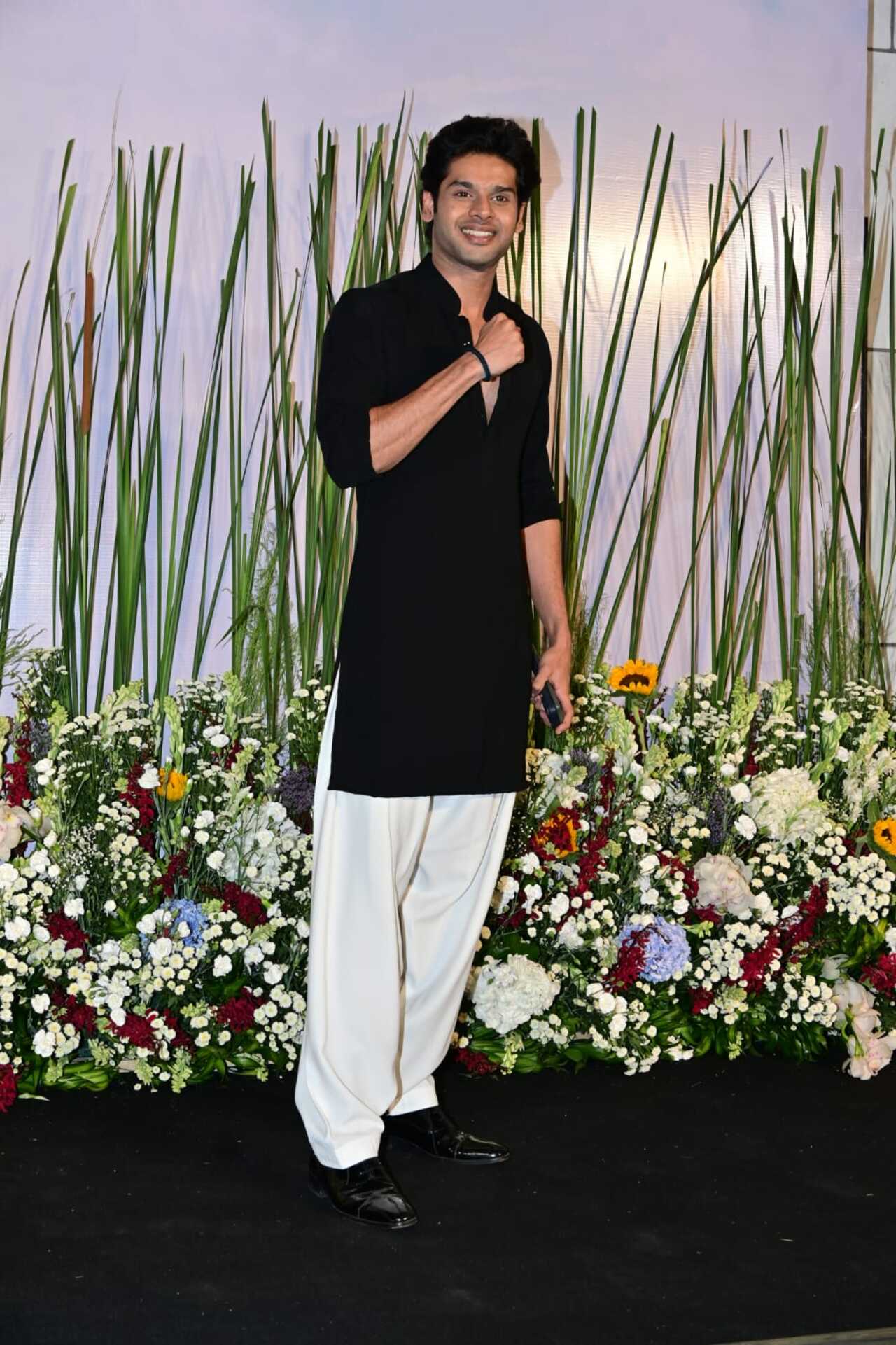 Abhimanyu Dassani posed for the paps dressed in a black and white kurta pajama set