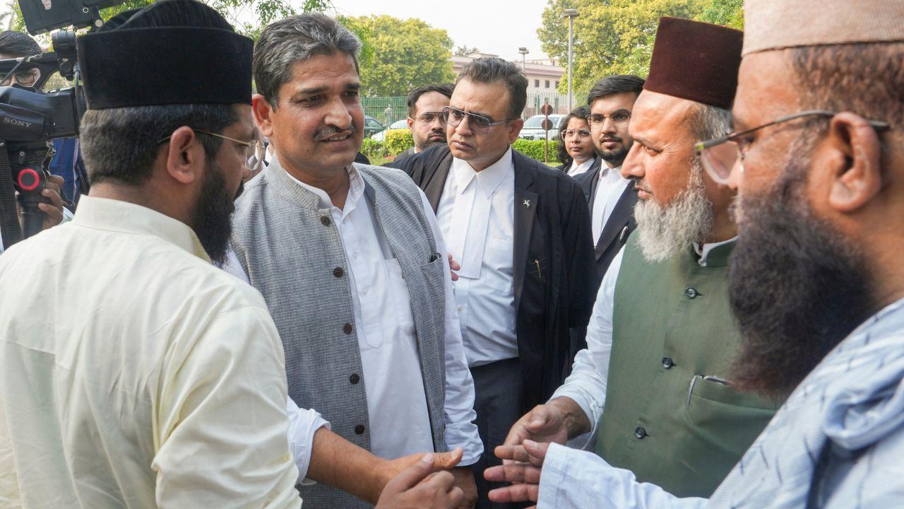 Petitioner and Congress MP Mohammad Jawed, centre, interacts with other petitioners