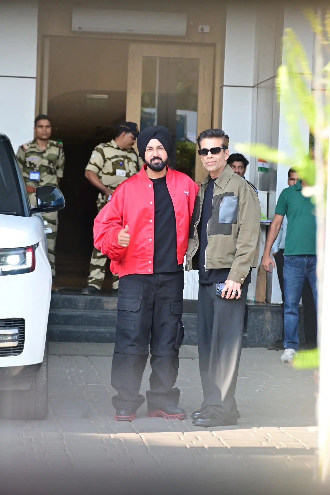 Gippy Garewal snapped at Kalina airport with filmmaker Karan Johar