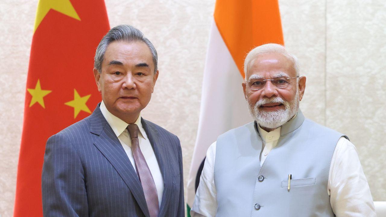 Chinese Foreign Minister Wang Yi met Prime Minister Narendra Modi on Tuesday and handed over a message and an invitation. (Pics/PTI)