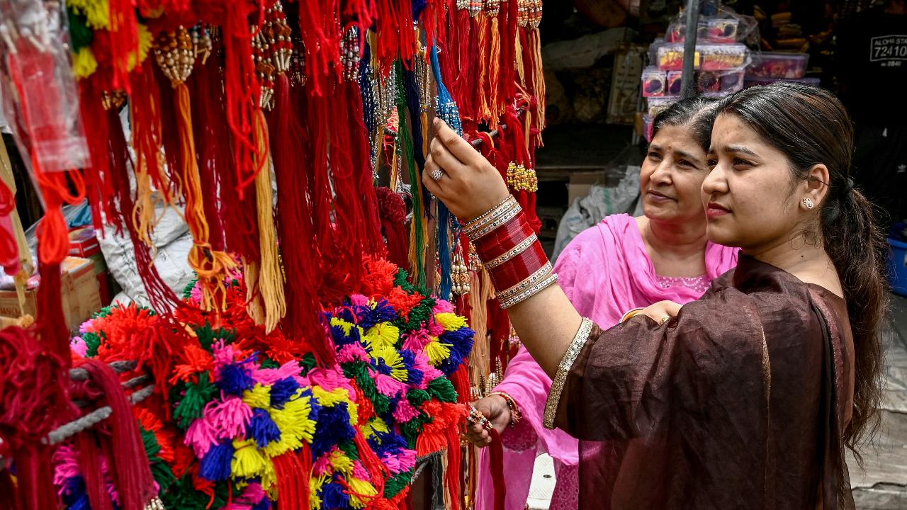 Amritsar, Punjab
Rakhi, a sacred thread, embodies the essence of Raksha Bandhan. Hence, people start shopping for it days in advance (Pic/AFP)