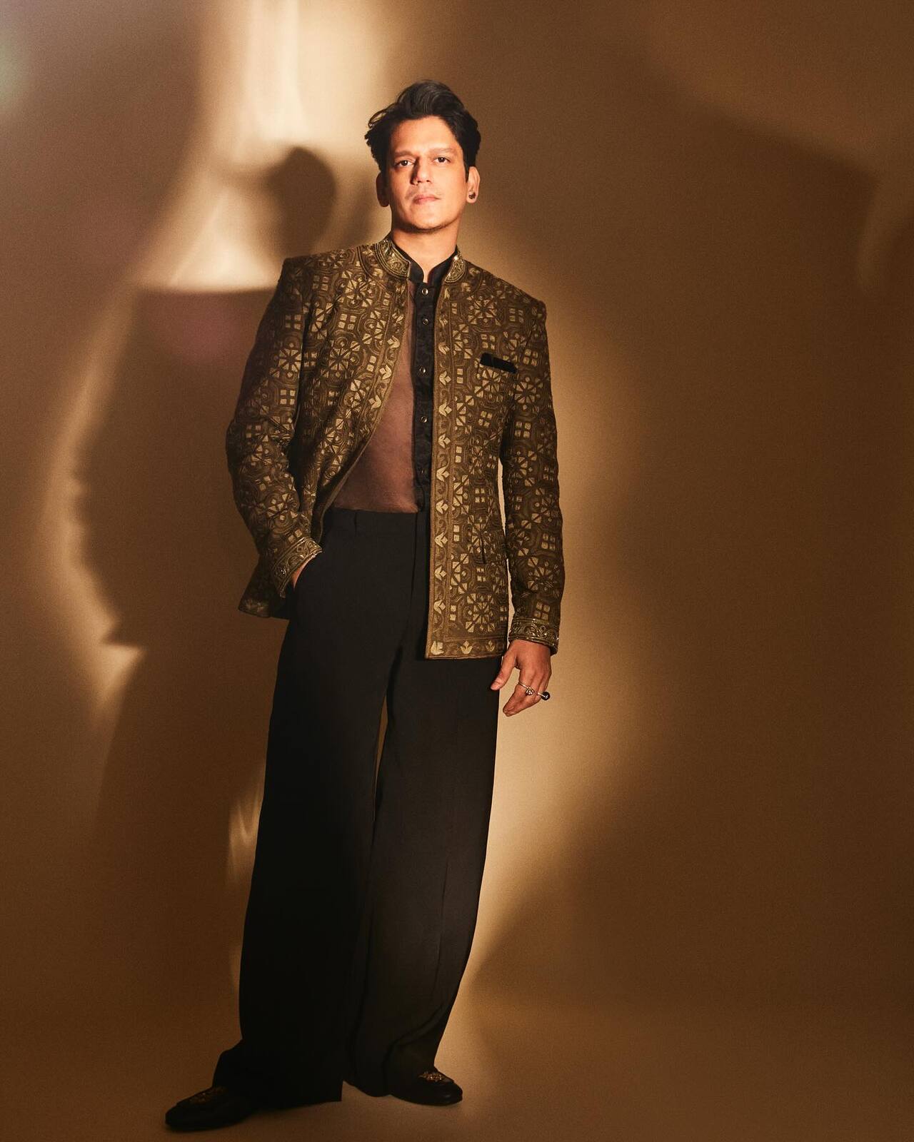 Always the trendsetter, Vijay experimented with a modern twist, donning a sheer shirt layered with a brown overcoat detailed with golden work. The mix of edgy textures and traditional accents made his outfit a standout moment this festive season.