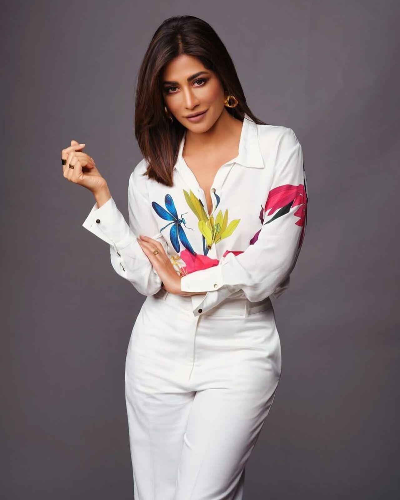 White on white may not be everyone's cup of tea, but Chitrangda nails it with utmost grace and confidence. Her subtle makeup enhances the outfit, while the pop of colours on the shirt bring in the drama.
