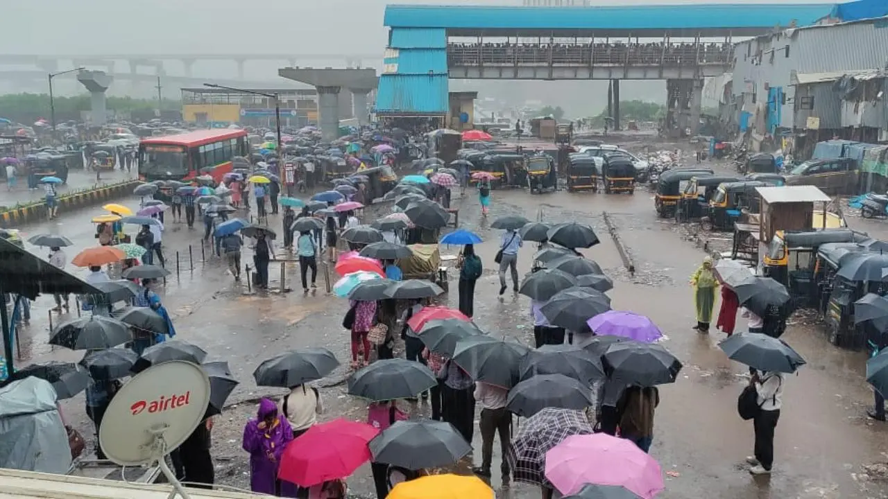 PICS: Mumbai office-goers brave heavy rain in Bandra East to get to work
