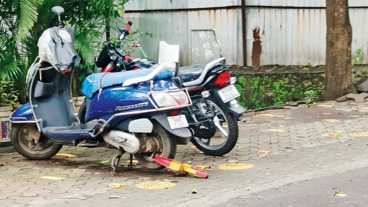 Kapure’s scooter lying clamped near the society gate