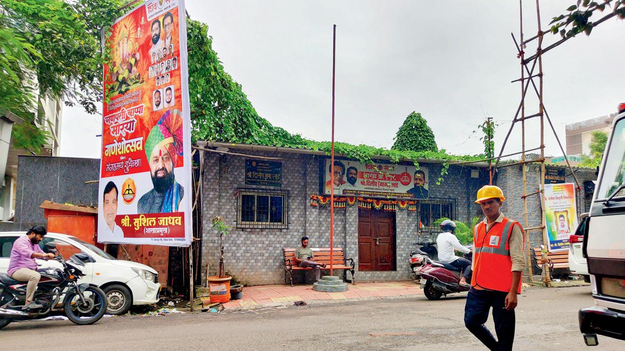 A political office blocks the path of a footpath. PICS/RITIKA GONDHALEKAR