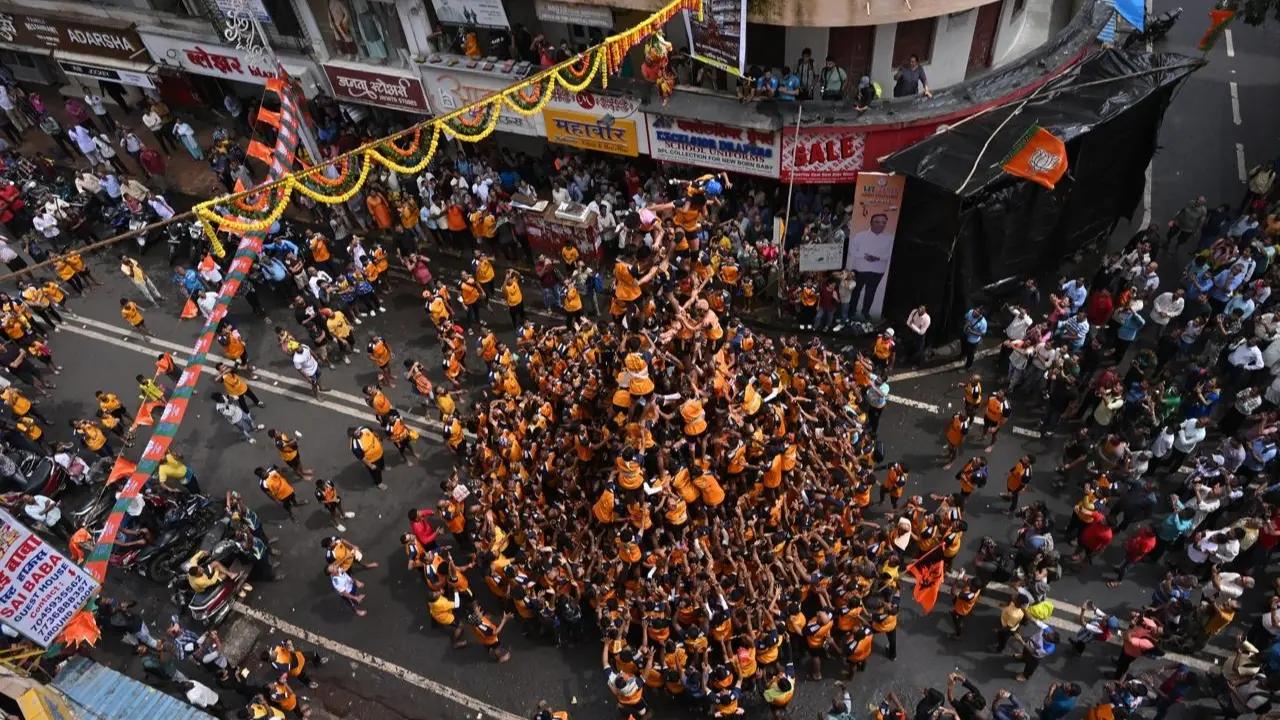 
This act is a symbolic recreation of Lord Krishna's childhood fondness for butter and his playful attempts to steal it
