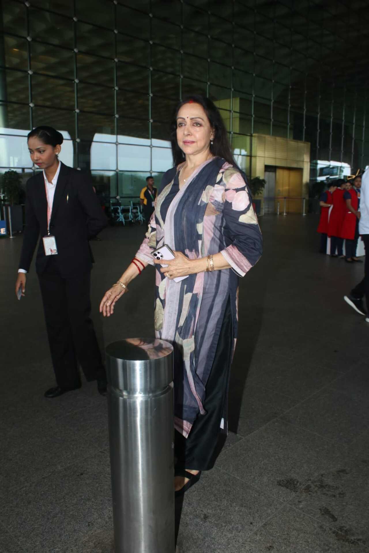 Sholay actress Hema Malini was also seen at the airport today as she headed out for a comfy travel in a loose cotton kurta.