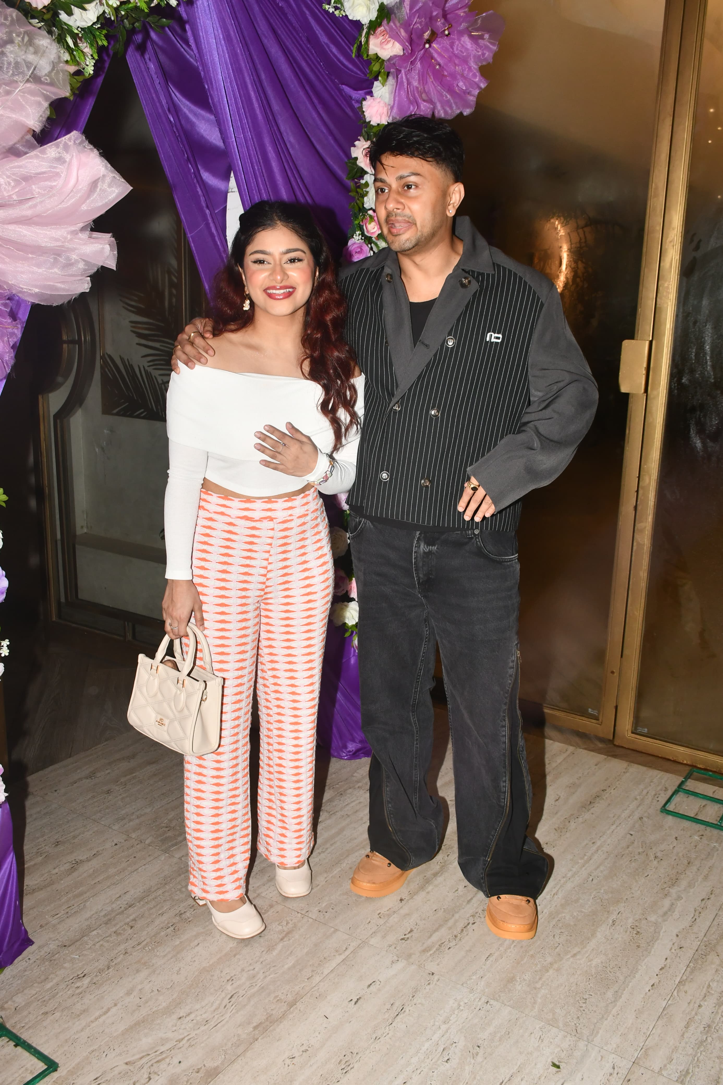 Siblings Awez and Anam Darbar were seen posing together at Guahar Khan's baby shower.