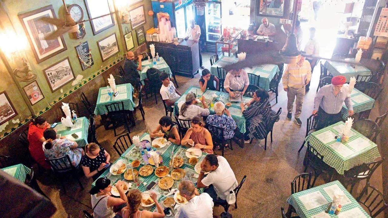 Dine where they used toRelish lunch at cafés that were serving Bombay when India became free. These spaces reflect the melange of post-Partition food culture, open to all castes after Gandhiji’s secular vision took hold. In 1947, these doors were a liberated space. Today, still a good reminder of how the city gathered as one.
Bade Miya, established in 1946, still slings its famed seekh kebab and Mughlai classics in the same corner. 
Britannia & Co in Ballard Estate has existed since 1923 and offers Parsi fare amid vintage décor that’s survived decades of change. 
Shree Thaker Bhojanalay in Kalbadevi opened before 1947 and still serves Gujarati thalis made, where your lunch, grain by grain, recalls years of tradition. 
Pancham Puriwala grew from a small shop in 1848 to a restaurant that still serves puris. It has seen the Bombay Fort and Mumbai city evolve.