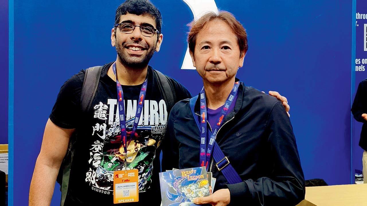 Jazyl Homavazir (left) gifts his anime series to Hideo Katsumata. PIC COURTESY/JAZYL HOMAVAZIR