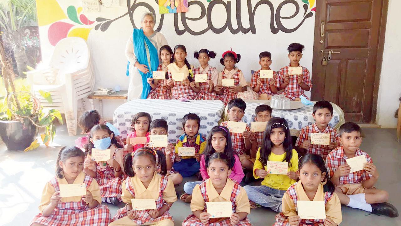 Minal Bhatia with schoolchildren and their postcards in Lonavala