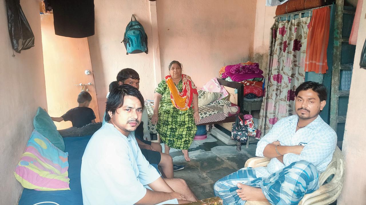 Kisan Shibaug with neighbours who have taken shelter at her house