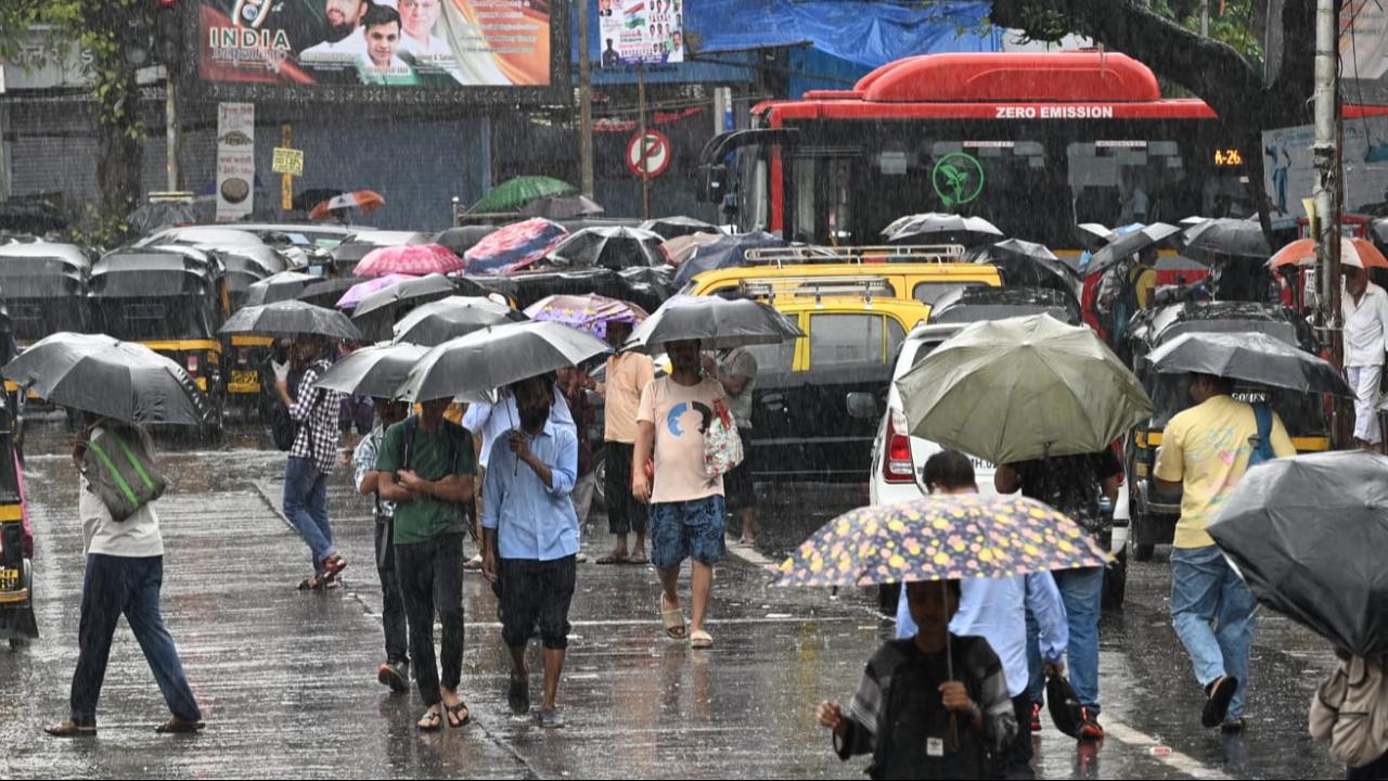 Mumbai weather : IMD issues red alert, heavy rains disrupt traffic and trains