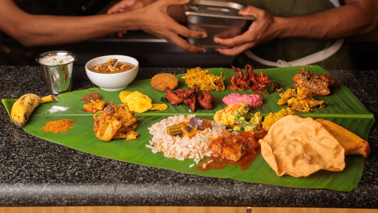 Sadhya in the suburbs Kari Apla is back with its second Onam celebration with a 22-dish non-vegetarian feast that is served on a banana leaf to showcase Kerala’s much-loved meat and seafood specials.
Some of the dishes on the menu including returning favourites like Suriani Squid Roast, Mutton Cutlet and Chicken Pepper Roast, alongside new introductions like the classic Kappa-Meen Curry, beloved across Malayali homes. 
The feast ends with Banana Fritters, co-founder and chef-owner Mathew Varghese’s favourite Kerala teatime treat, inspired by his grandmother’s kitchen
Where: Kari Apla, Bandra West When: September 5 to 7; Reservations open on August 26Time: 11:30 am onwards Price: Rs 2100 plus taxes per person Call: +91 8433706258 or reservations
