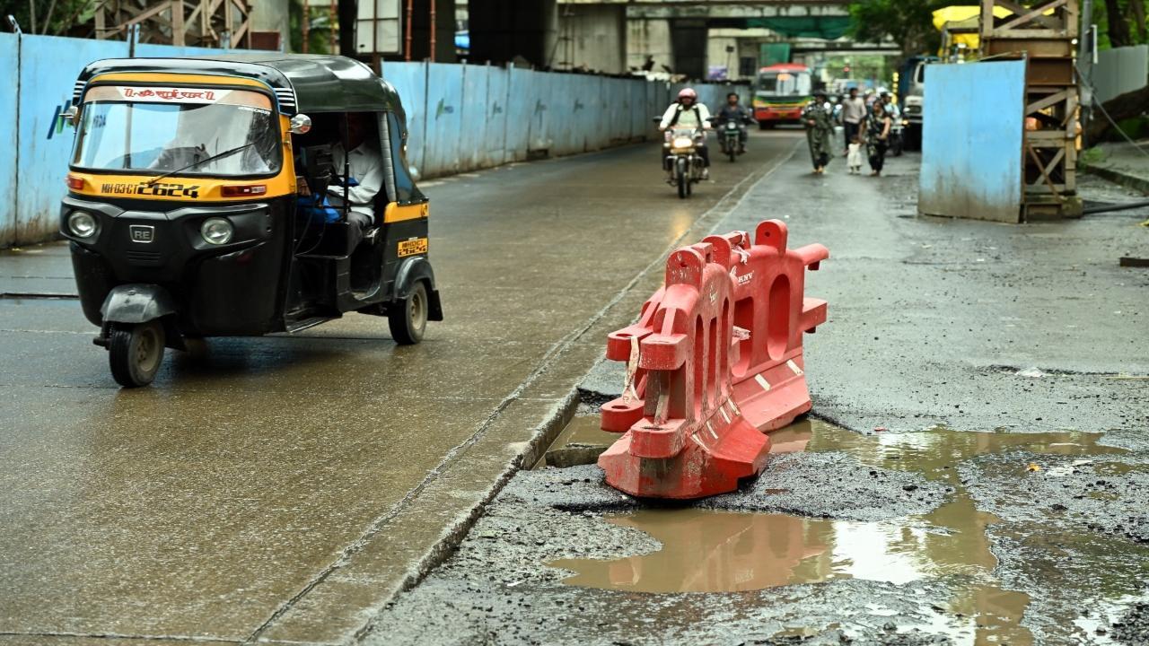 A pothole-ridden road at Swastik Park in Chembur. PIC/KIRTI SURVE PARADE