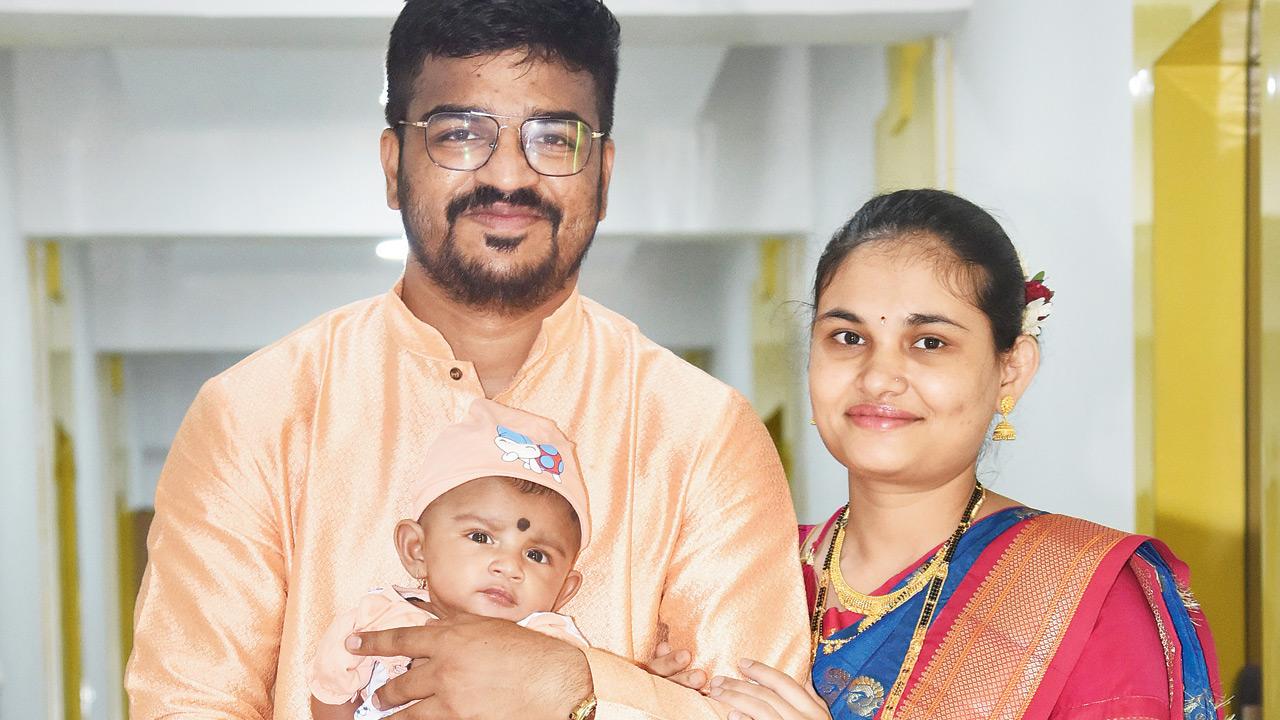 Rohan Prakash Kandar with wife Neha and their son Yash