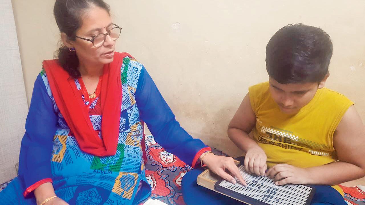 NAB’s Programme Coordinator, Ujwala Bhanushali, wades through flooded Virar streets to reach her visually impaired students