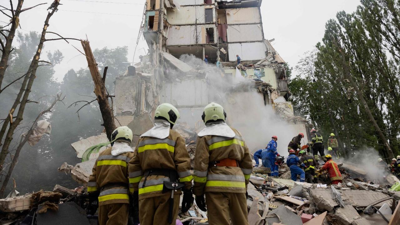 A large part of a nine-story residential building collapsed in the attack, City Military Administration head Tymur Tkachenko said. Rescue teams searched for people trapped under the rubble