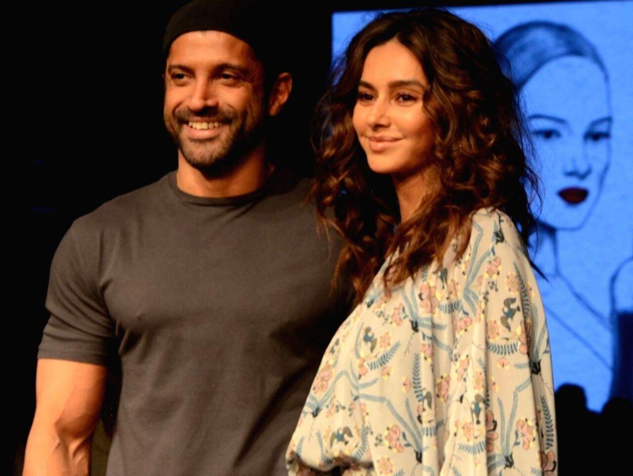 This picture from their early dating days shows how much in love they were, looking happy, yet coy.