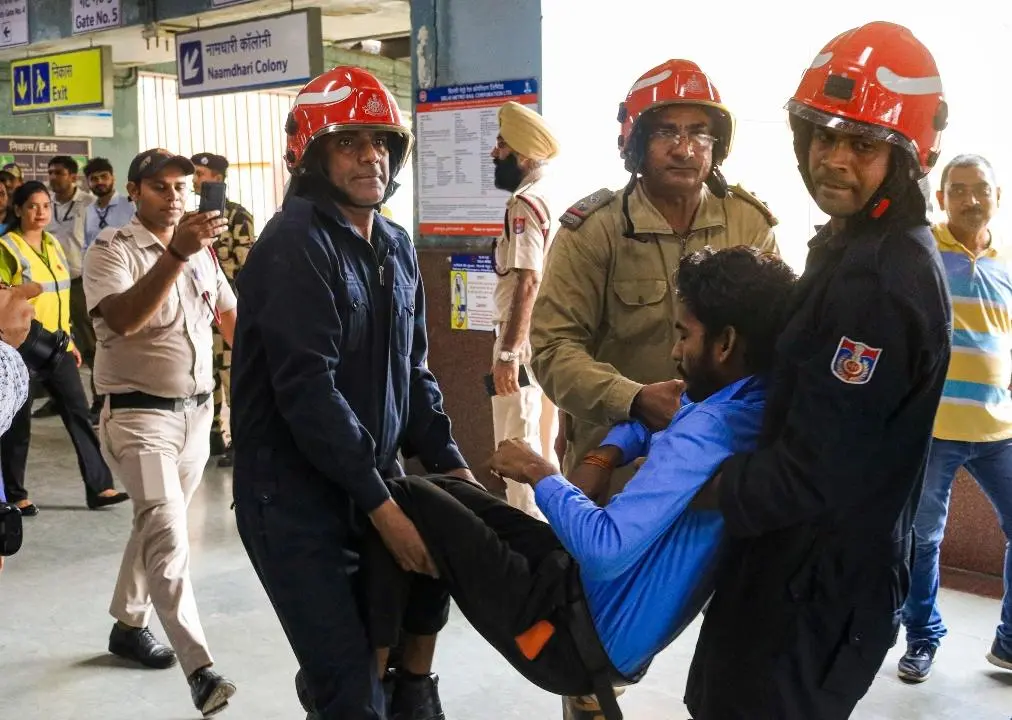 Members of the Delhi Disaster Management Authority conduct the earthquake and fire safety mock drill. Pic/ PTI