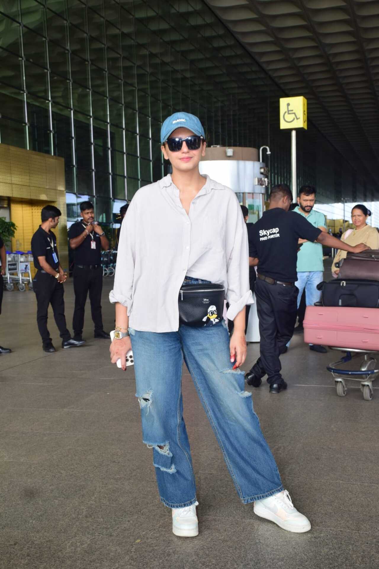 <p>Huma goes for a casual look as she nails the white shirt and a pair of denims with a cap</p>