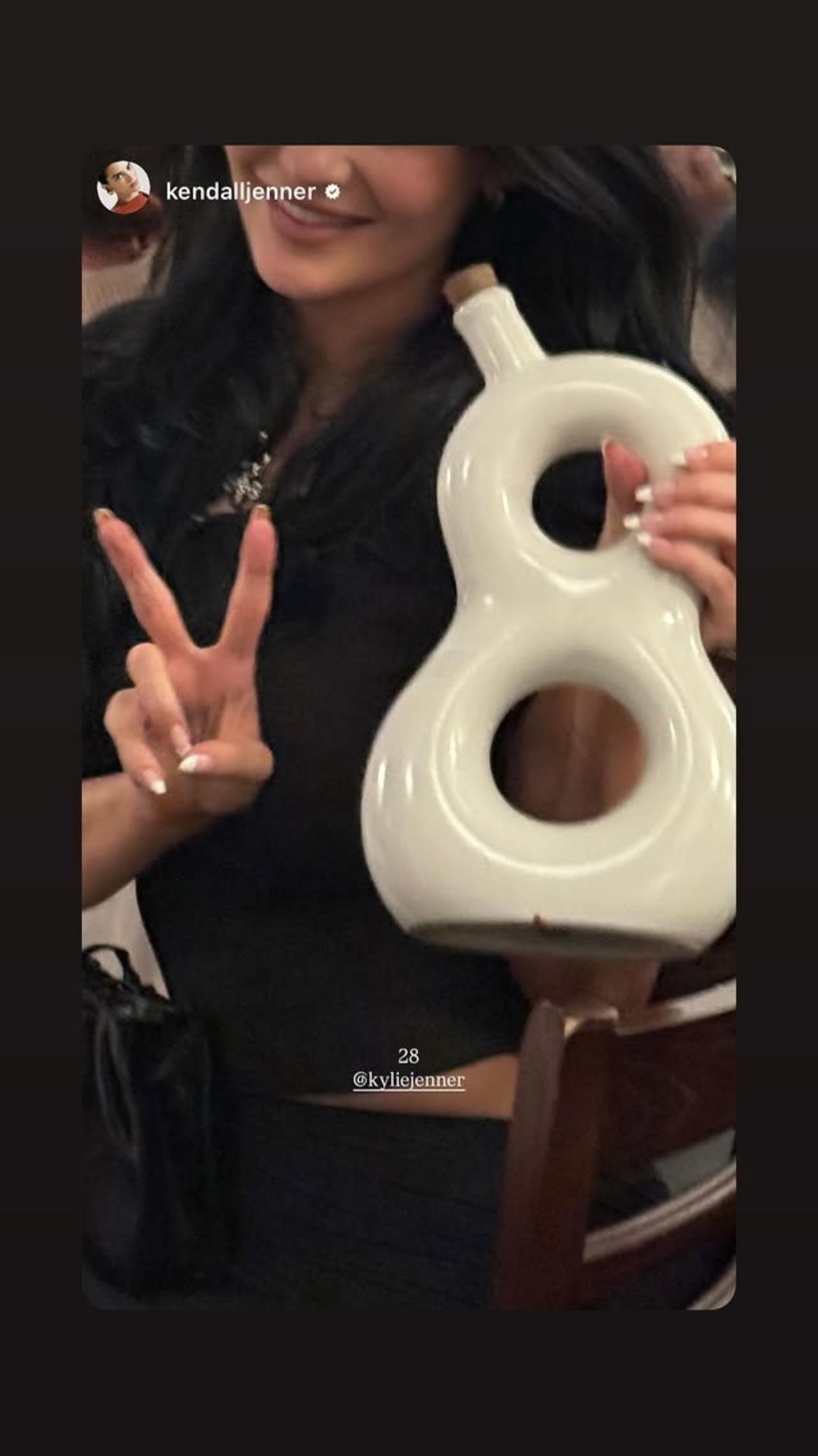 Kylie Jenner turned 28. She reshared her sister Kendall's Instagram story, wishing her. Kendall shared a picture of Kylie holding a bottle in the shape of the number '8' and wrote 28, tagging her sister.