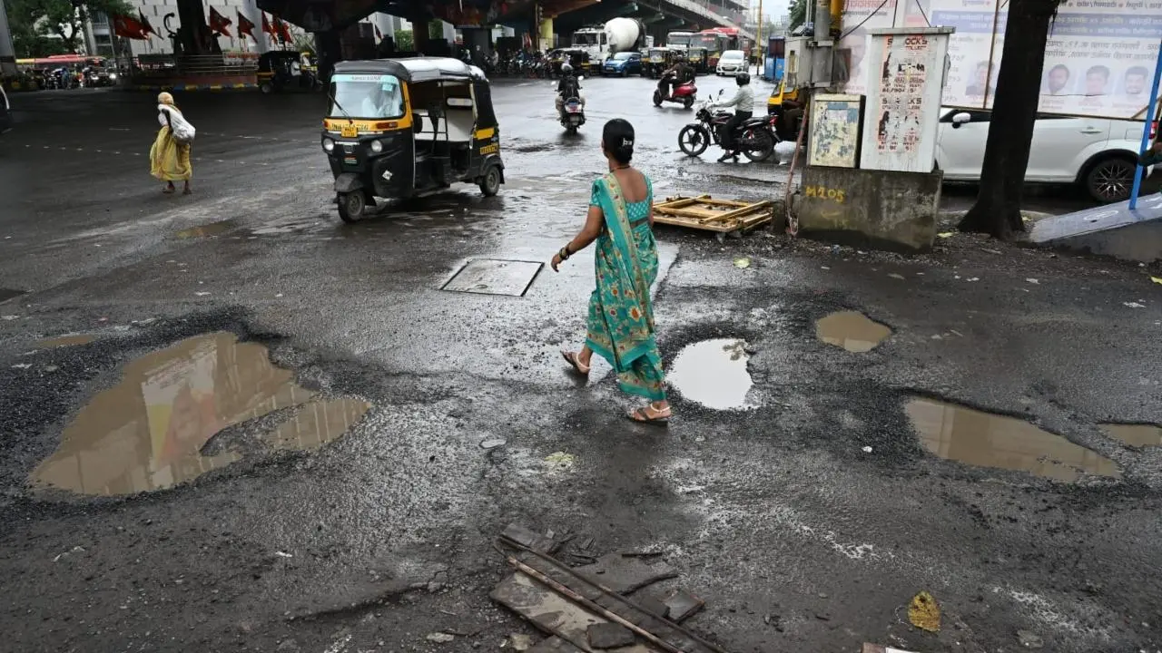 IN PHOTOS: Large potholes appear near Magathane bus depot in Mumbai