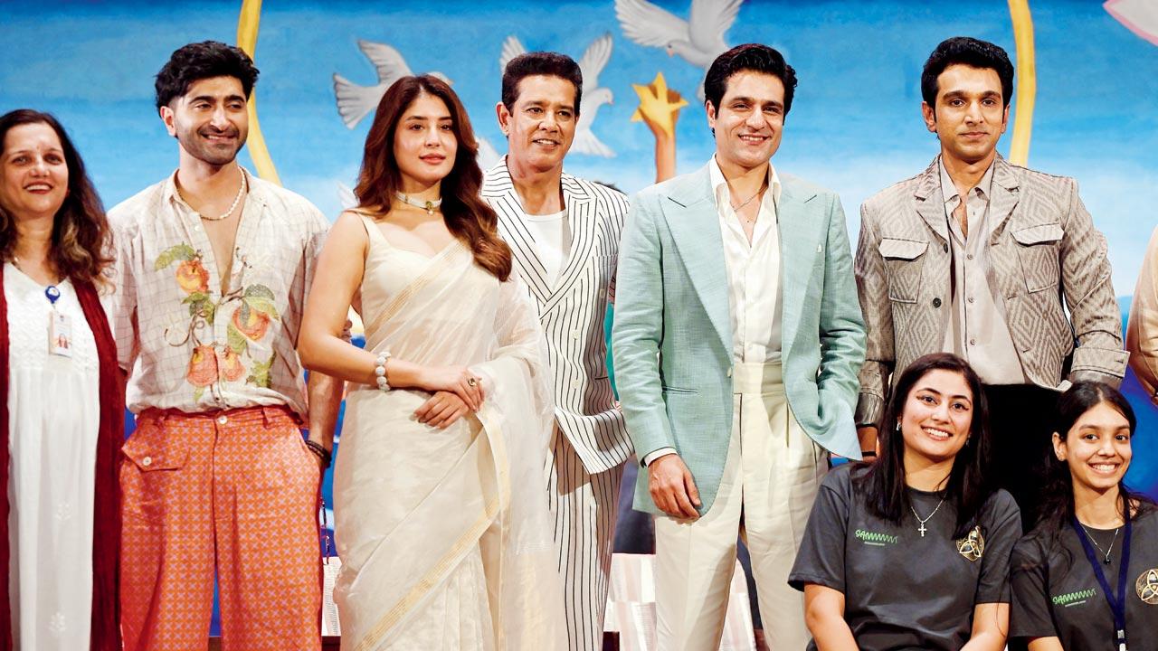 The cast with the students