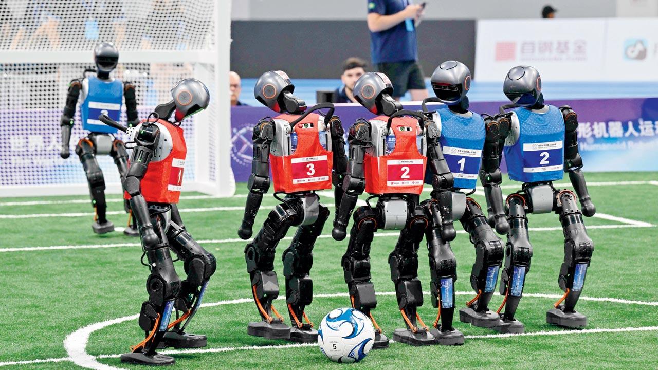 Robots compete in a 3X3 football match