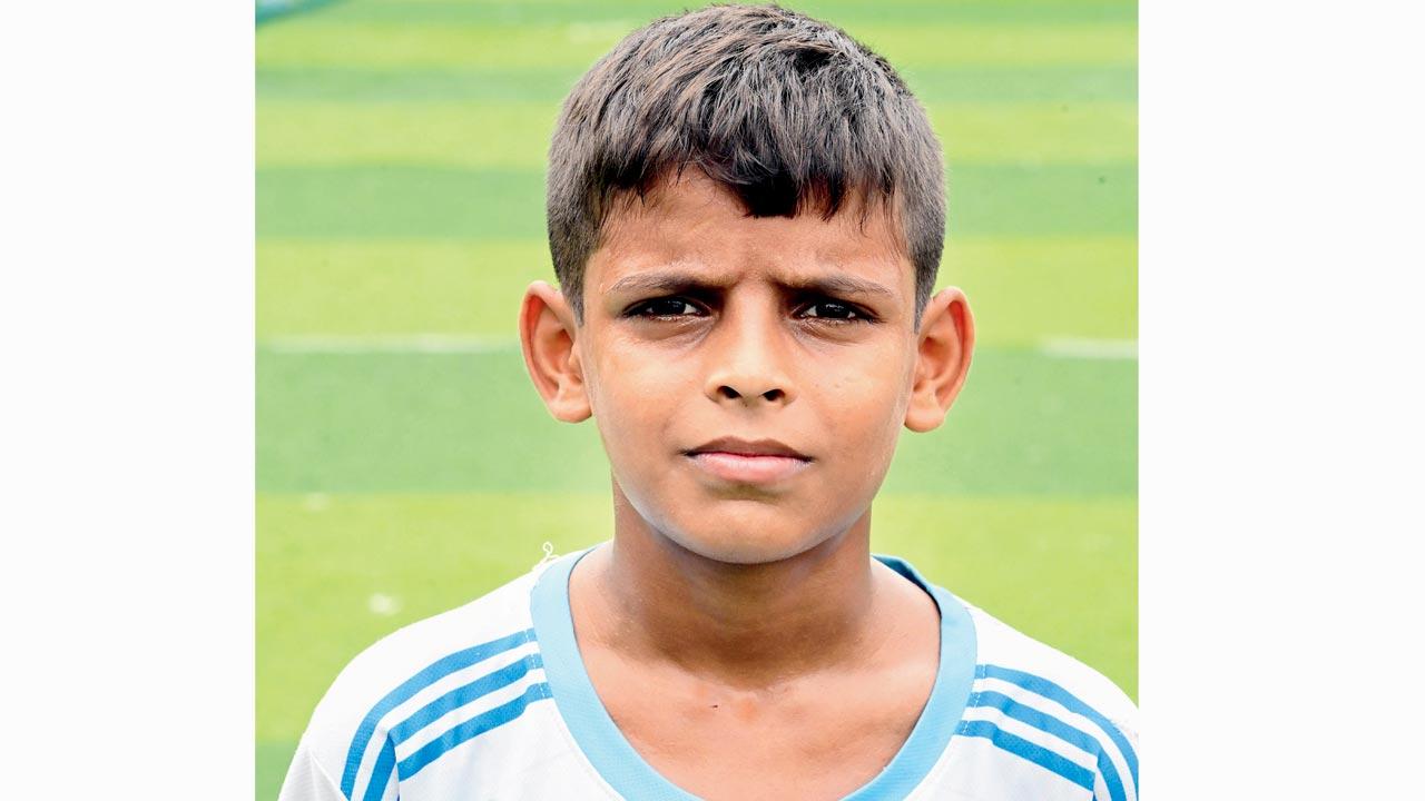 “Everyone does it. All the time,” Sourabh, a 12-year-old boy from Nehru Nagar talks about the drugs that haunt his friends. “But I come to the ground to run. I’m not going to be like them.” Pic/Nimesh Dave