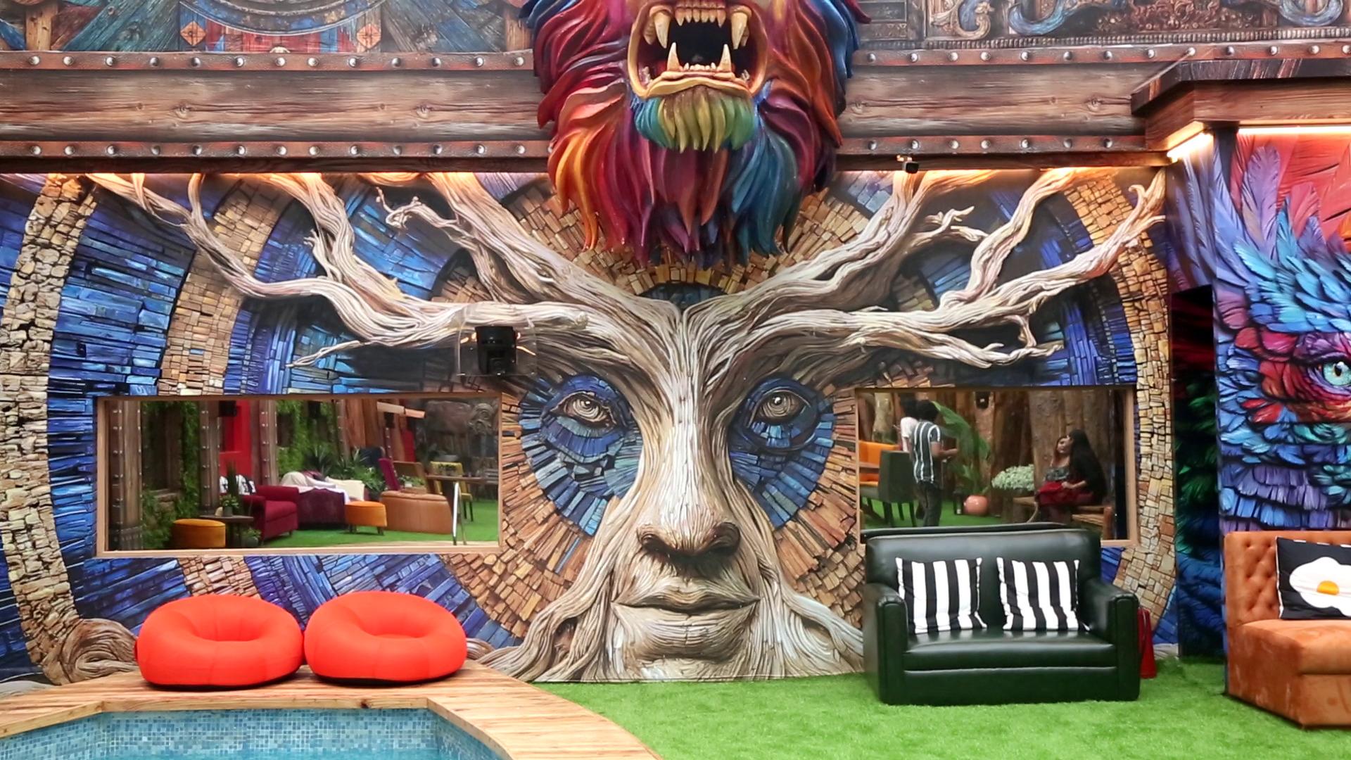 The enchanted face and tree in the kitchen area also have a colourful lion above it.