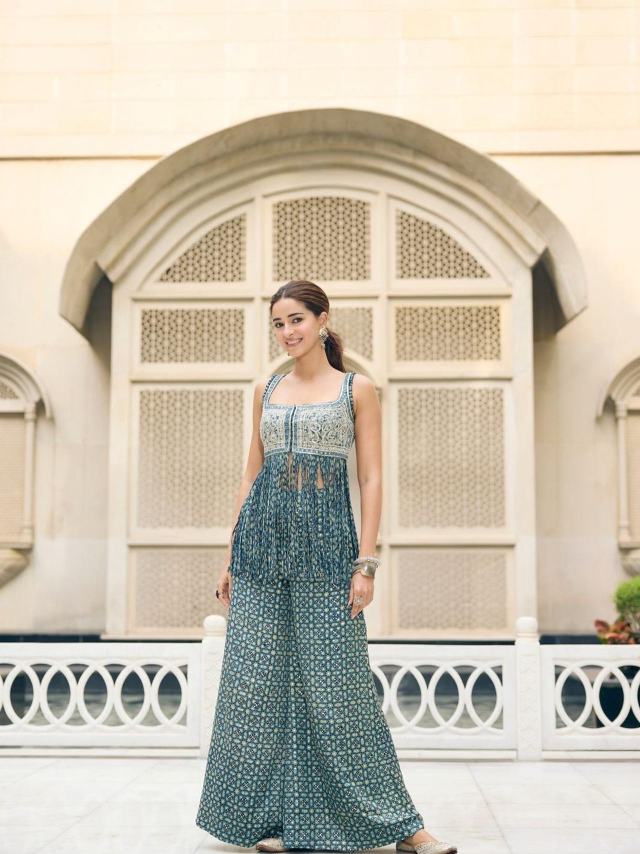 <p>Ananya looks elegant in this ajrakh print jumpsuit with embellished bodice. She styled it with silver jhumkas, stacked bangles, and hair neatly tied back.</p>