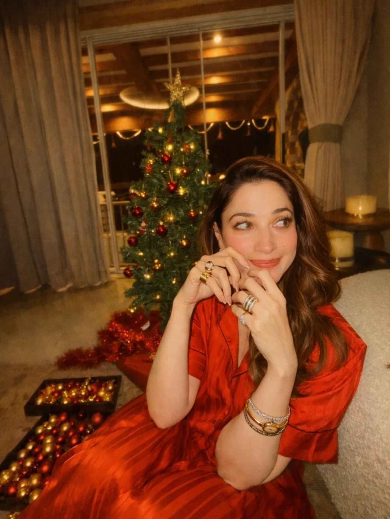 Tamannaah Bhatia leaned into comfort and Christmas hues with a silky red pyjama set. She posed beside a towering tree, giving glimpse of her cosy celebration.