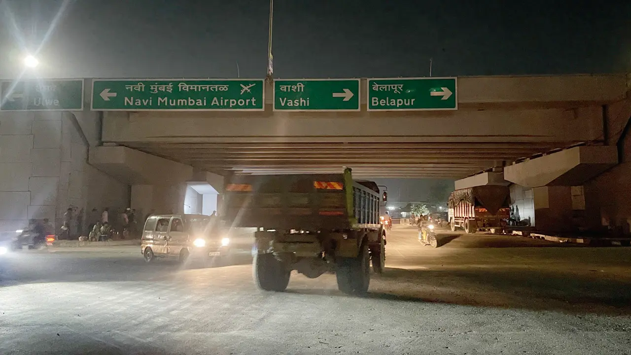 The unlit stretch of the Navi Mumbai International Airport Road near Panvel, where street lights have not worked since the airport inauguration