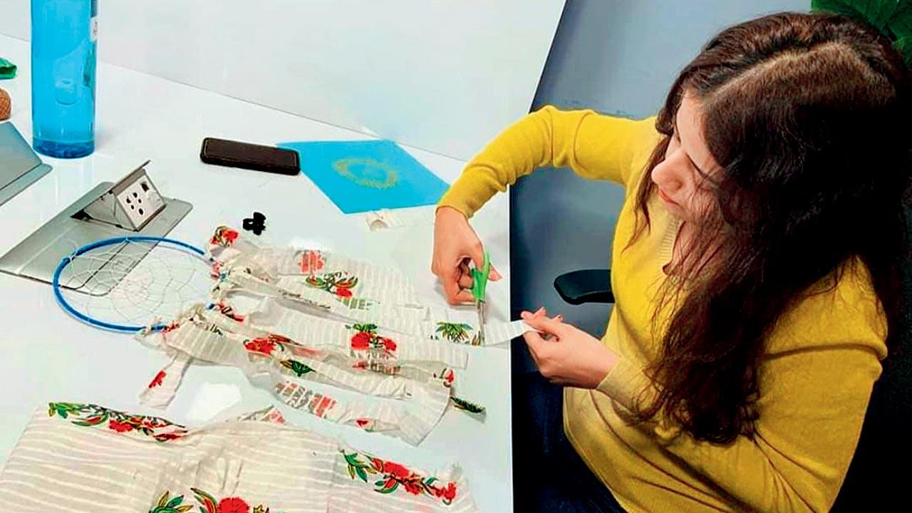 A participant works with fabric