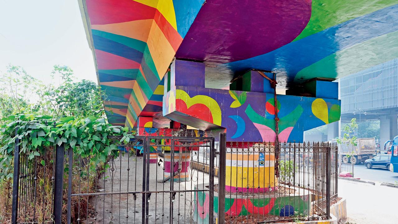 Locked entrance to the fenced space beneath the flyover