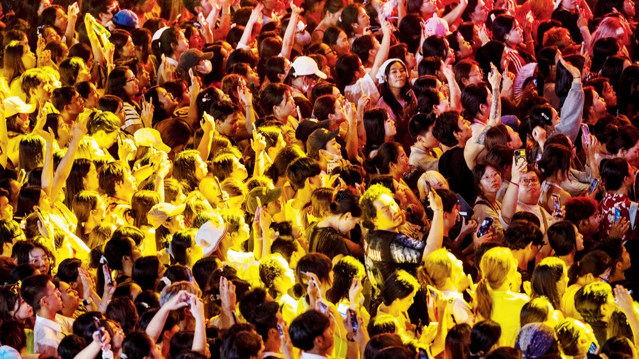 A large crowd celebrates at a countdown event in downtown Bangkok, Thailand. PIC/Getty Images