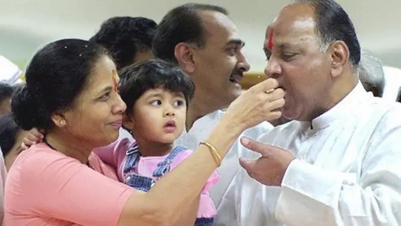 Sharad Pawar eats a piece of cake from his wife Pratibha's hand as his granddaughter Revati looks on during his 61st birthday celebration. PIC/ Mid-Day archives 