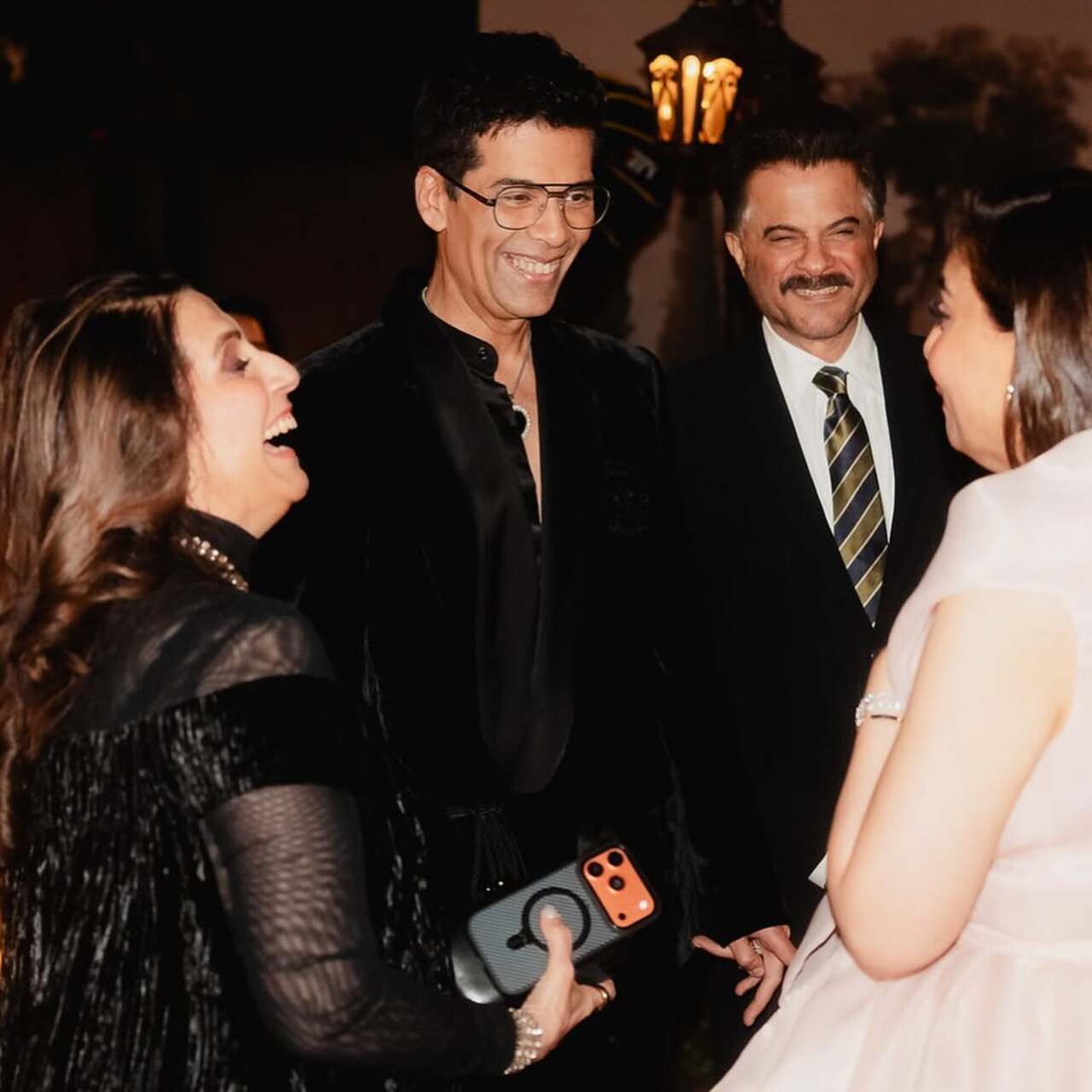 Another had her engrossed in a conversation with Anil Kapoor, Sunita Kapoor, and Karan Johar. They were seen having a hearty laugh.