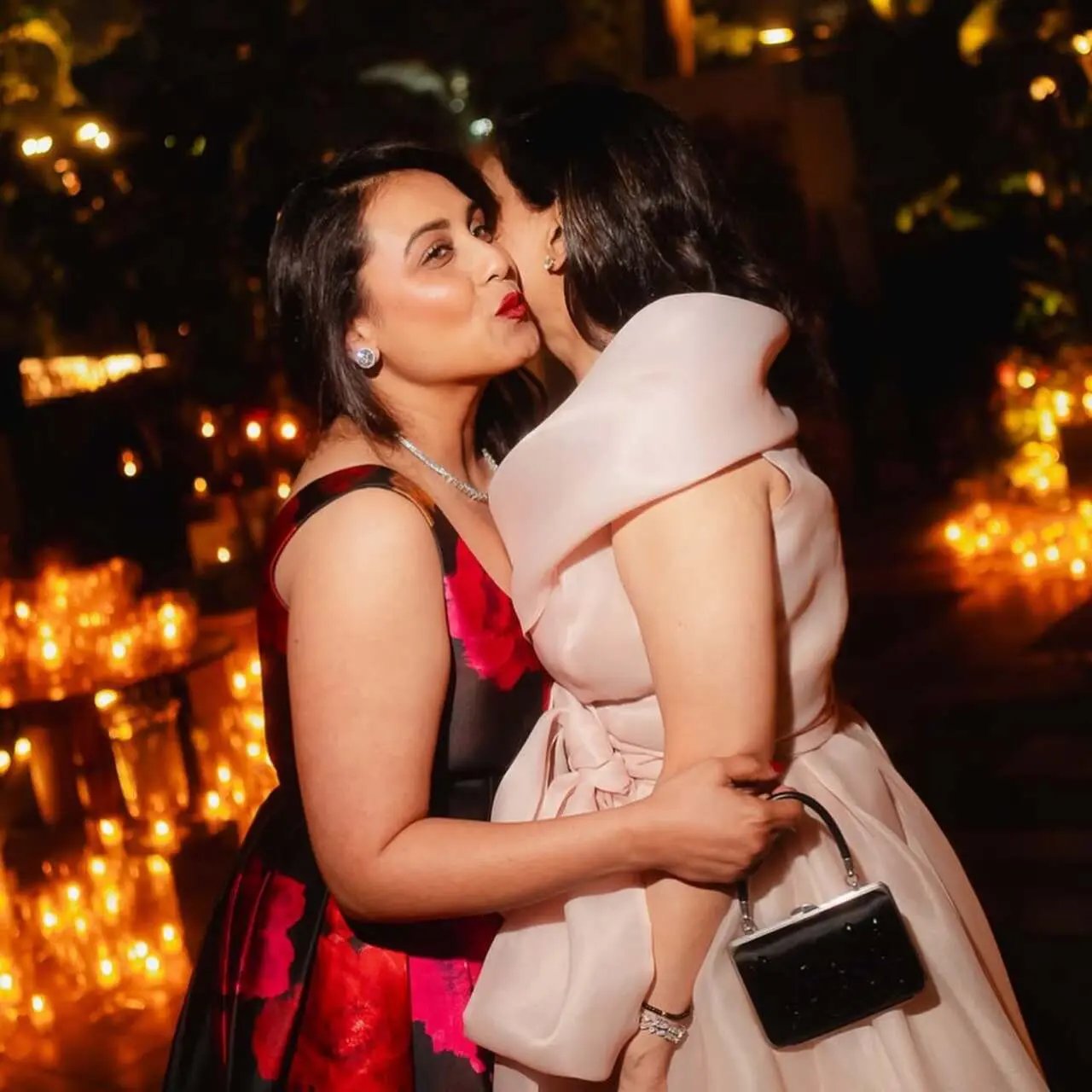 One of the standout photos captured a warm moment between the birthday girl and Rani Mukerji, as the two shared a heartfelt hug. Rani looked elegant in a black dress adorned with bold red floral prints.