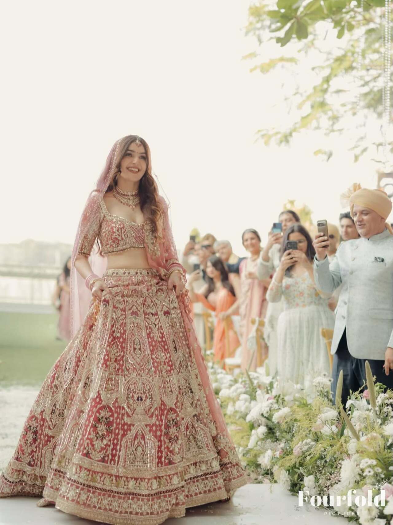 <p>Her look is completed with traditional jewellery&mdash; a statement necklace, matching earrings, stacked bangles, and soft makeup which looks graceful.</p>