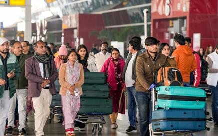 Passengers at Terminal 3 (T3) of the Indira Gandhi International Airport, in New Delhi amid crisis. Pic/PTI