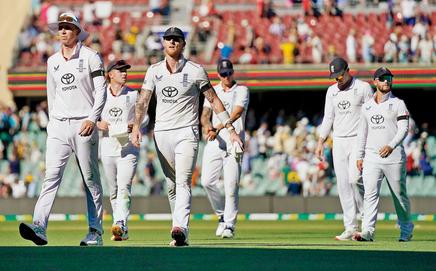 England skipper Ben Stokes (third from left) leads his team off the field on Day One of the third Test in Adelaide last week. Pic/Getty Images