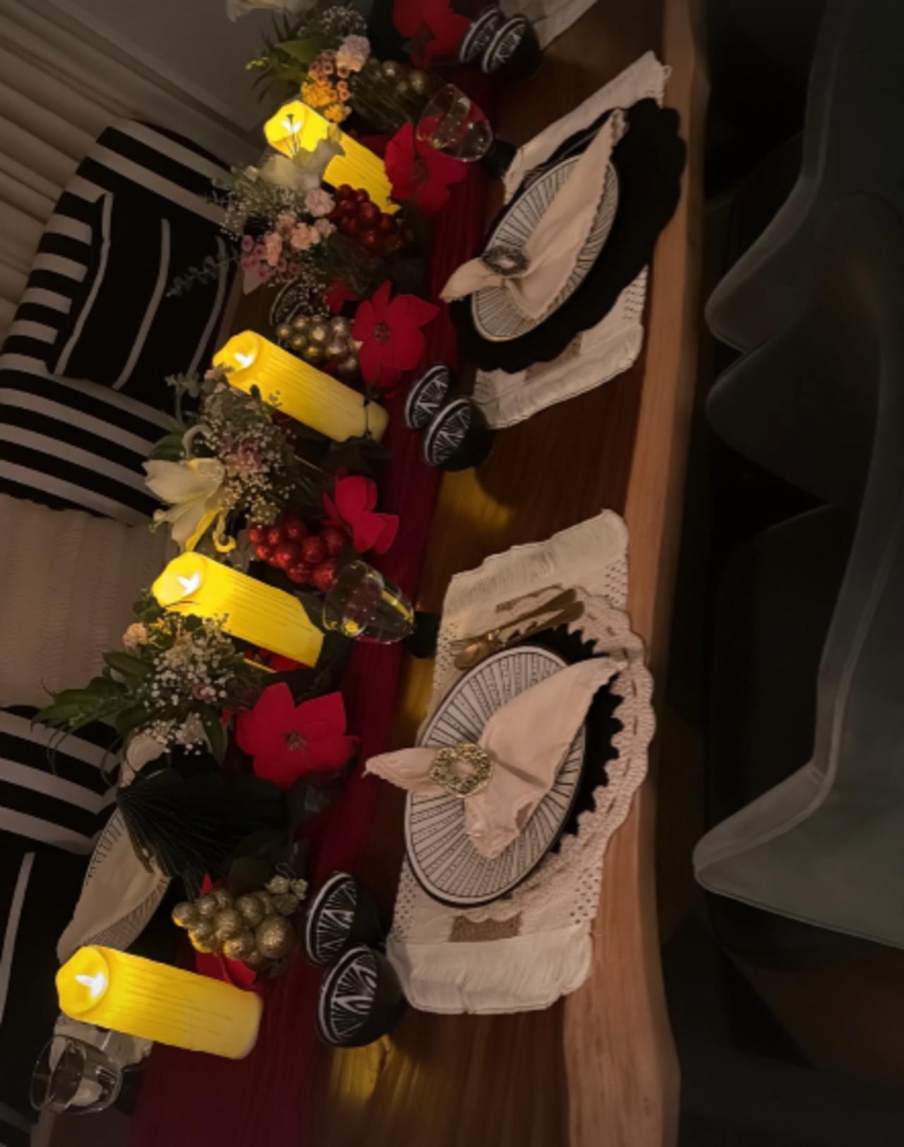Nupur shared a picture of the aesthetic dining table setup with candles, flowers and cutlery.