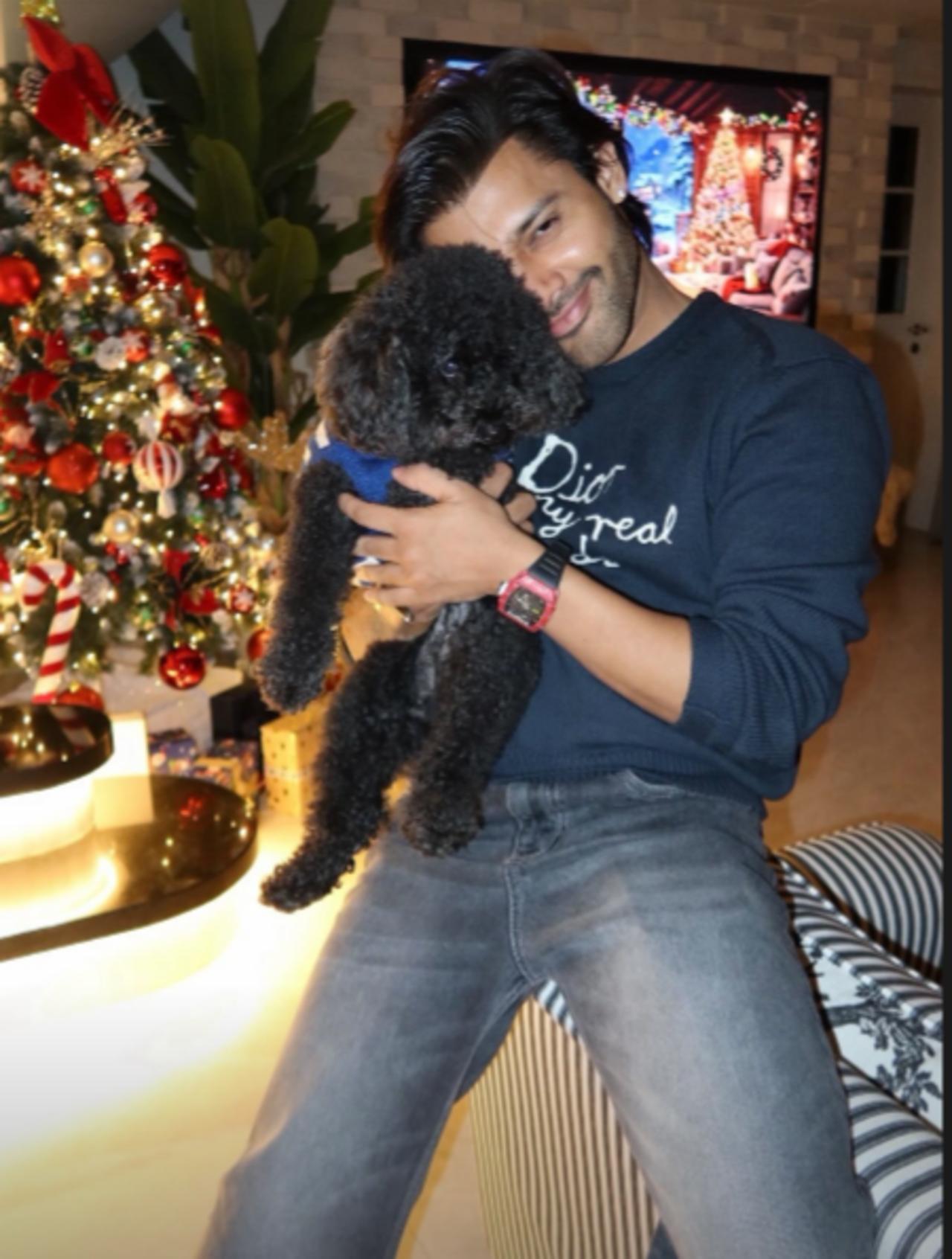 Stebin also shared an adorable picture of himself cuddling with his pet. He was seen dressed in a blue tshirt and denims.