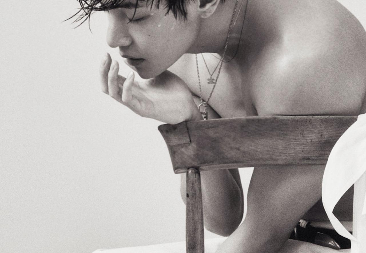 <p>Kim casually shows off his shirtless body in this picture, which happens to be from a photoshoot.</p>