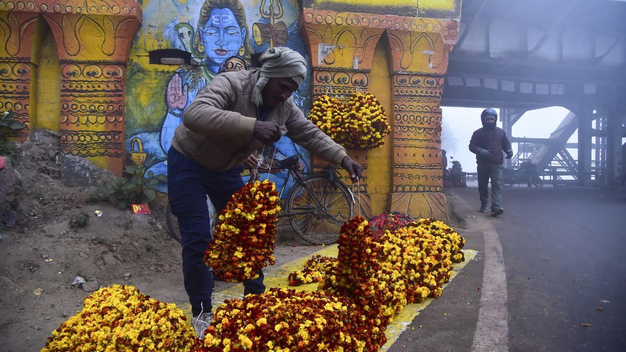 At flower markets, vendors sat waiting for customers, while others carried garlands through the misty streets, hoping to sell offerings meant for temples and household prayers